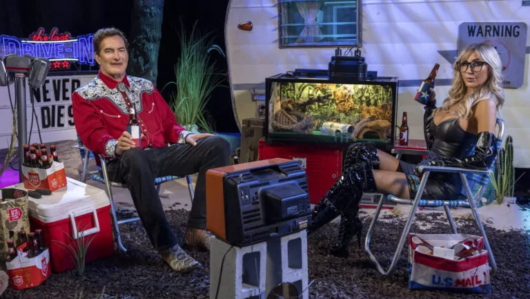 Joe Bob Briggs and Darcy the Mail Girl on the set of The Last Drive-In